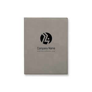 Gray leather-bound notebook with a black logo and text on a white background