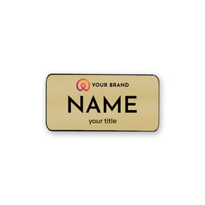 Large Gold name tag with a logo on a white background